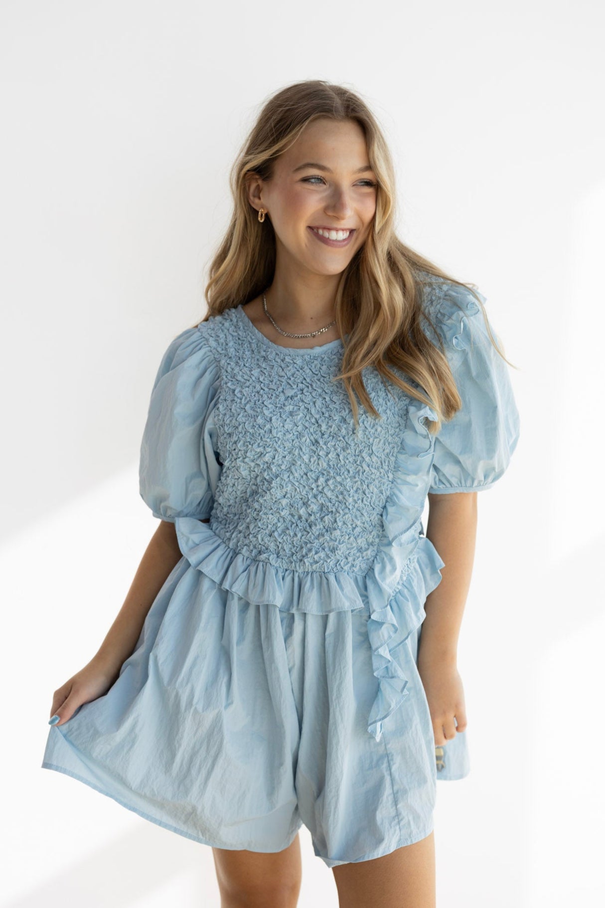 NOA RUFFLE SMOCKED ROMPER