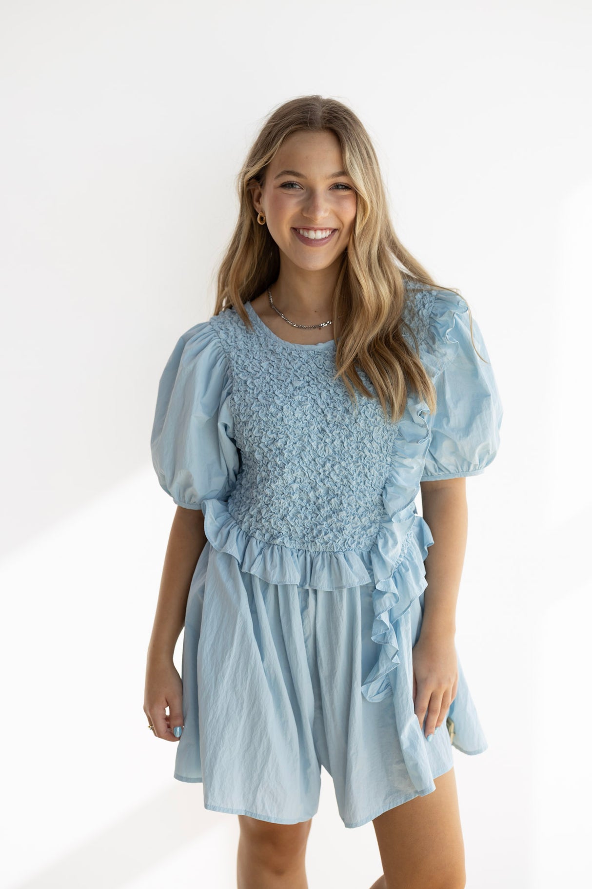 NOA RUFFLE SMOCKED ROMPER