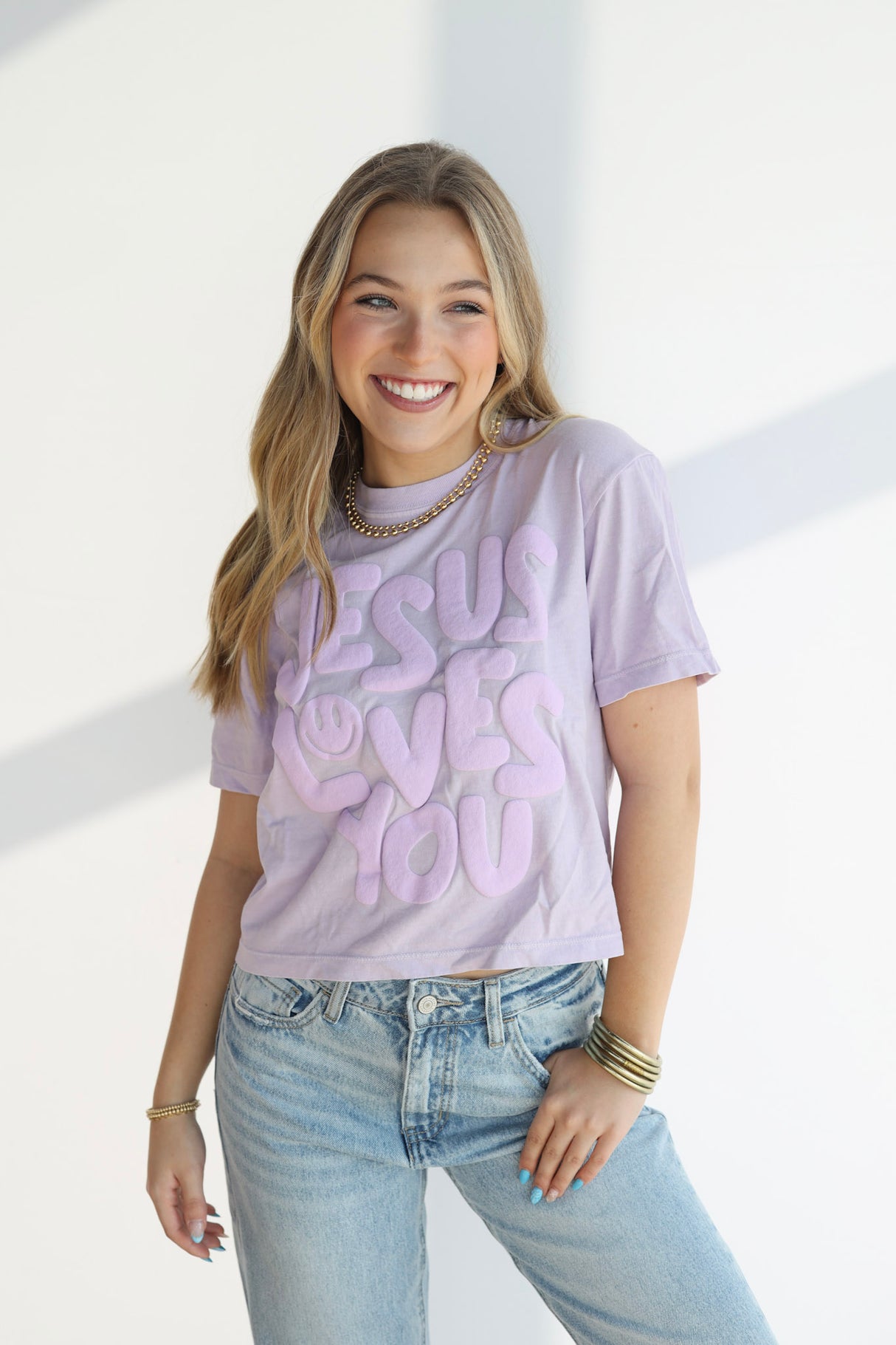 ORCHID SMILEY JESUS LOVES YOU TEE